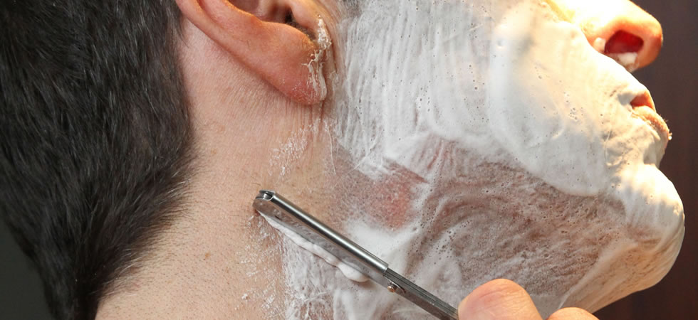 man cut throat shaving