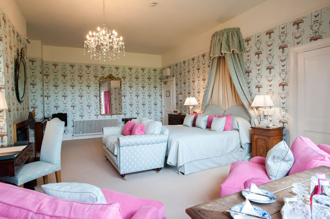 Bedroom with Original Laura Ashley wallpaper - exclusive at Llangoed Hall Hotel