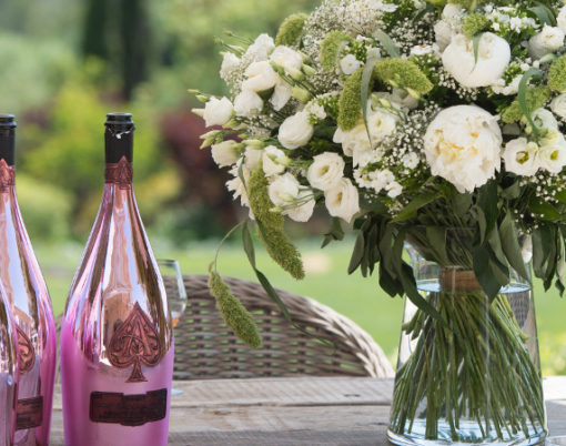 Table Setting + Rose_ Credit Getty + Champagne Armand de Brignac