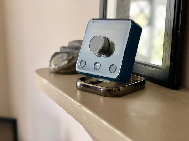 DUNWICH, SUFFOLK - APRIL 25, 2018: A Hive Smart Thermostat on a stand inside a house in Dunwich, Suffolk, UK. The technology allows central heating to be controlled from a smartphone.