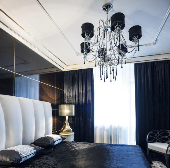 Dark bedroom Golden lamp blue silk velvet laconic interior