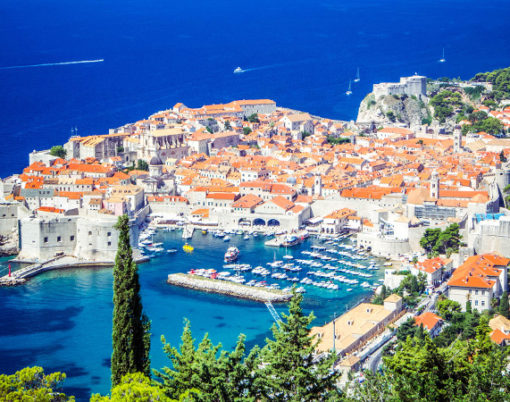 Panoramic view of Old Town (medieval Ragusa) and Dalmatian Coast of Adriatic Sea in Dubrovnik. Blue sea with white yachts, beautiful landscape, aerial view, Dubrovnik, Croatia