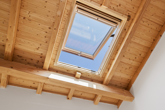 A Skylight Window on a wooden roof