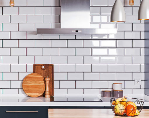 Modern interior. Spacious kitchen with white brick tile wall.