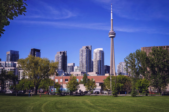 Toronto, Canada - 06 09 2019: Summer came to Toronto city. Summer view on downtown Toronto with CN tower from Martin Goodman Trail
