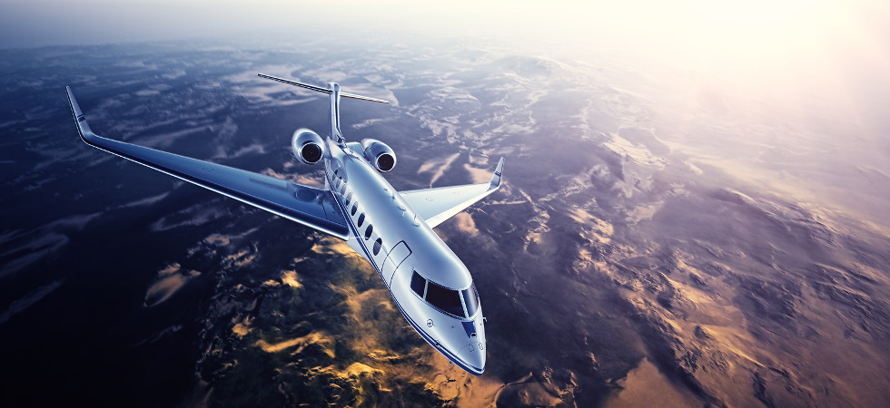 Realistic photo of silver generic design private Jet flying over the mountains. Empty blue sky with sun at background.Business Travel by modern Luxury Plane.Horizontal.Closeup photo. 3D rendering