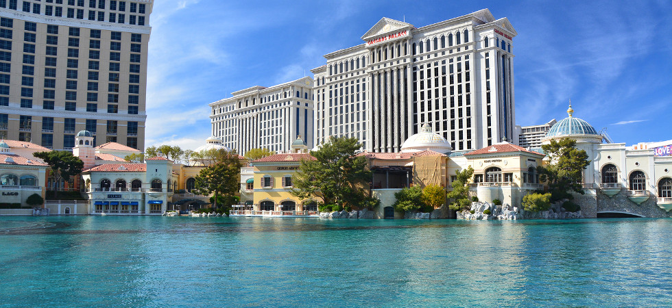 LAS VEGAS, USA - MARCH 18, 2018 : Fountains of Bellagio - Bellagio Hotel & Casino and Caesars Palace in the background.