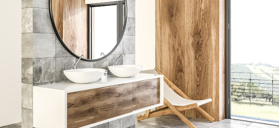 White double sink on wood counter with a round mirror hanging above it in a luxury marble and wooden wall bathroom interior. Spa Hotel. Deck chair 3d rendering