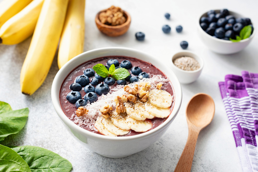 Acai Smoothie Bowl With Superfood Toppings On Concrete Backgroun