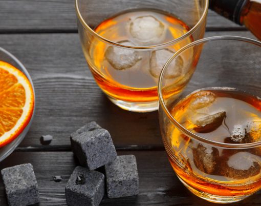 Whiskey And Whiskey Stones On A Wooden Table