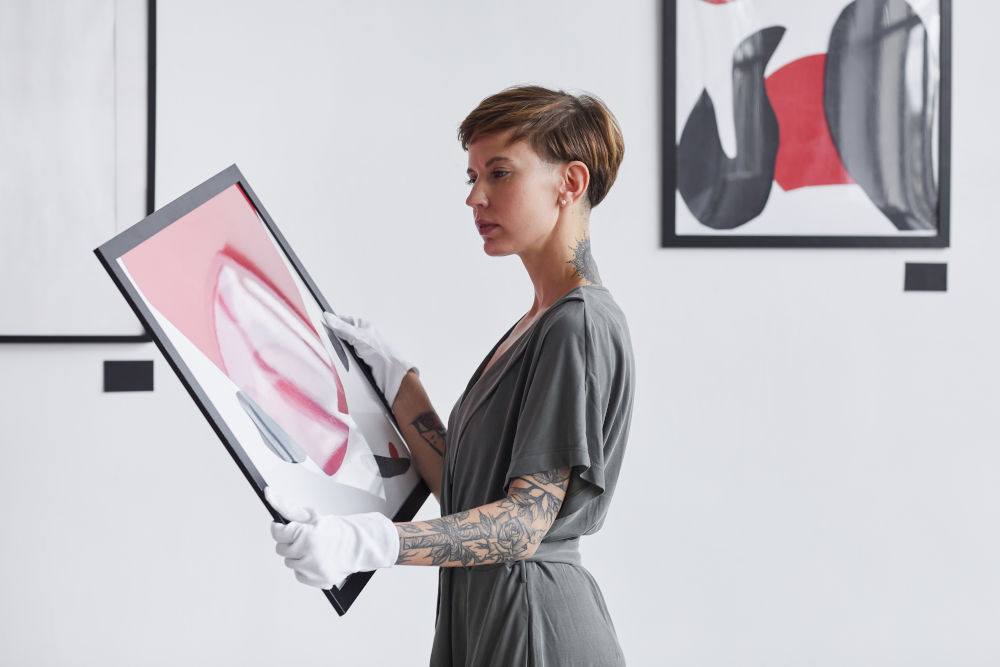 woman holding painting