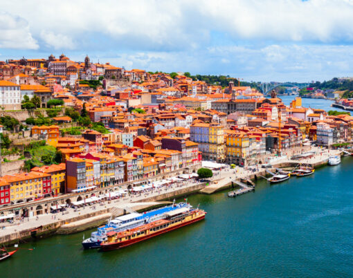 Douro River And Local Houses With Orange Roofs In Porto City Aer