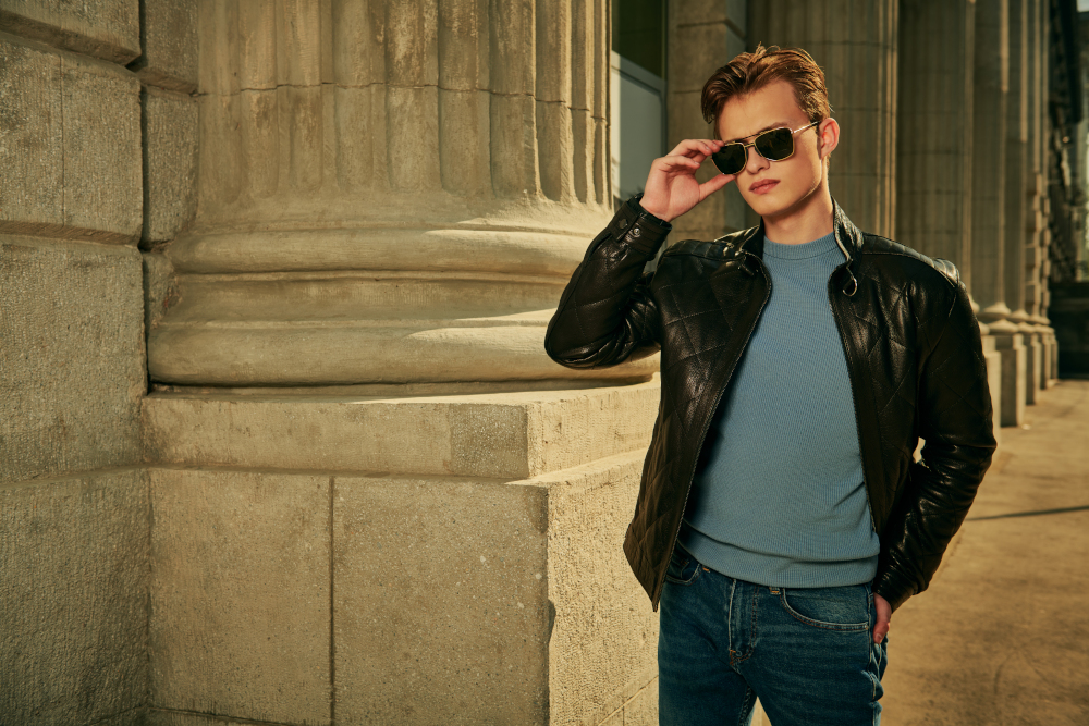 young man in sunglasses and leather jacket