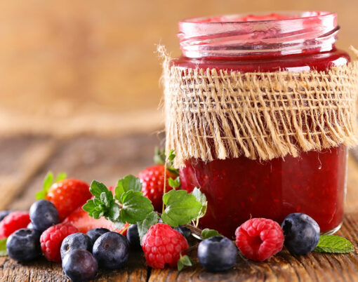 bigstock-berry-fruit-jam-on-wood-backgr-427301369
