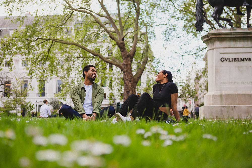 people sitting on grass at St James's Place