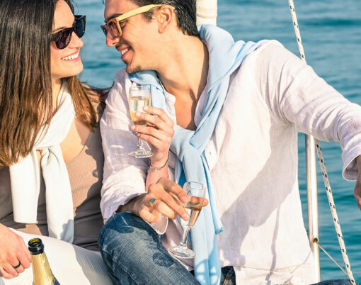 couple on boat drinking champagne