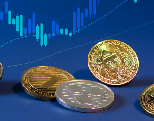 Various cryptocurrency coins with bitcoin in the centre on blue background