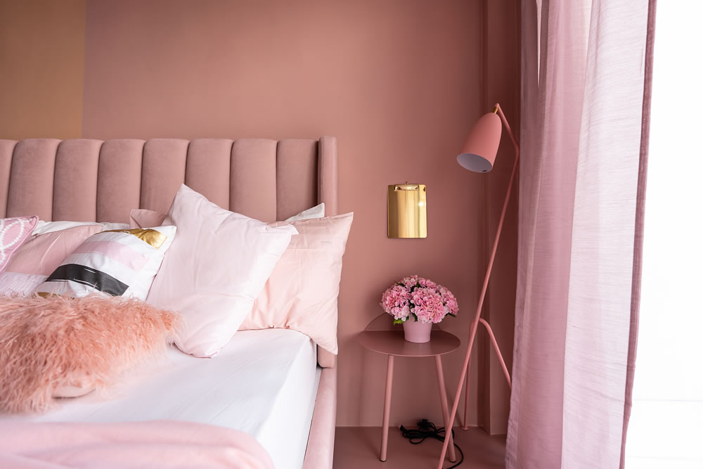 Cozy Pink Bedroom corner with baby pink velvet fabric bed 
