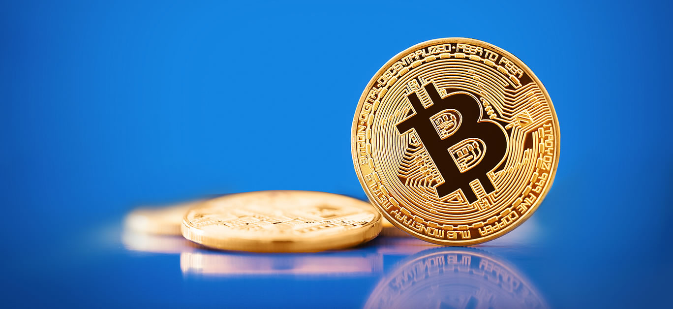Gold Bitcoin on the blue background. Concept of crypto currency.