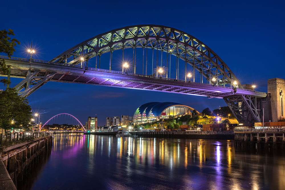 Looking down the Tyne River to Gateshead and the Tyne bridge from Newcastle Upon Tyne Quayside
