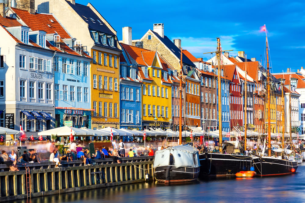 Famous old Nyhavn port in the center of Copenhagen, Denmark during summer sunny day