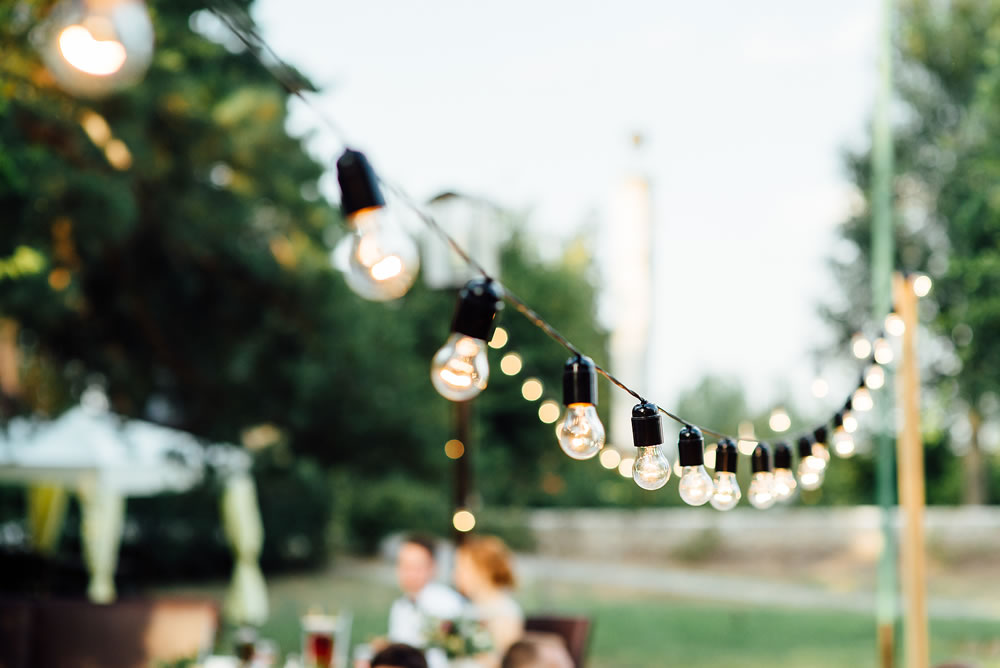 Light bulb decor in outdoor party. Wedding day