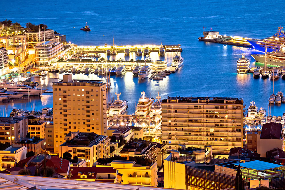 Monte Carlo yachting harbor and colorful waterfront evening view, Principality of Monaco