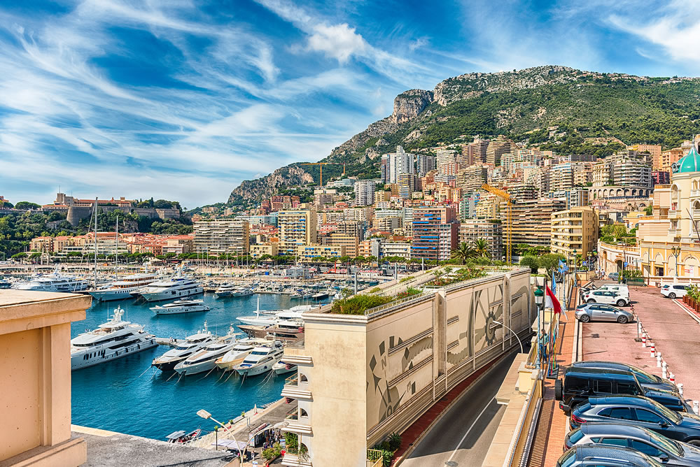View over luxury yachts and apartments of Port Hercules in La Condamine district, city centre and harbour of Monte Carlo