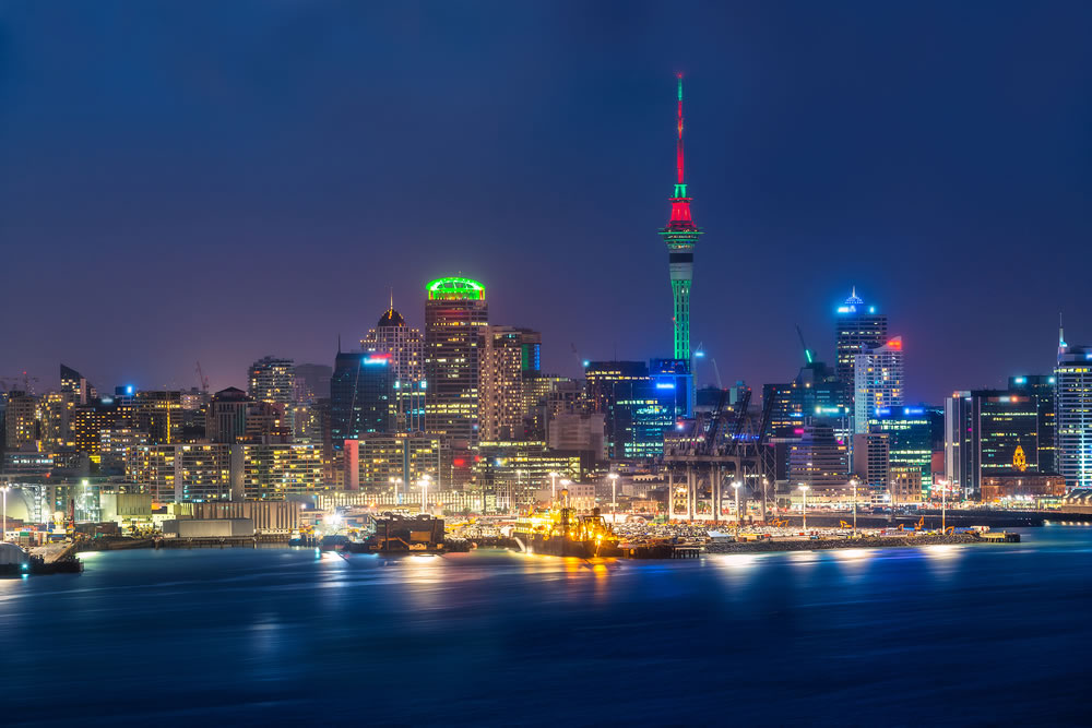Auckland city skyline at night with city center and Auckland Sky Tower the iconic landmark of Auckland New Zealand.