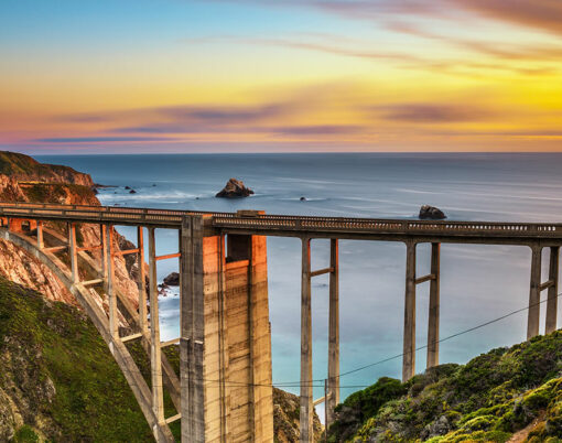 Bixby Bridge also known as Rocky Creek Bridge and Pacific Coast Highway at sunset near Big Sur in California, USA. Long exposure.