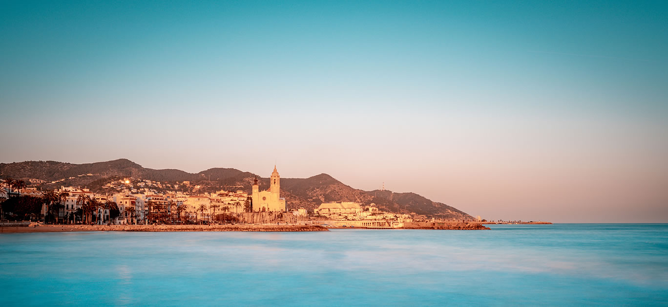 Blue hour view of mediterranean town of Sitges in Barcelona province. Spain.