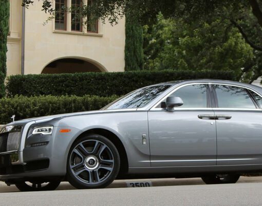 Rolls-Royce Ghost in Jubilee Silver parked on a street of the wealthy Highland Park neighborhood of Dallas, Texas on September 22, 2017.