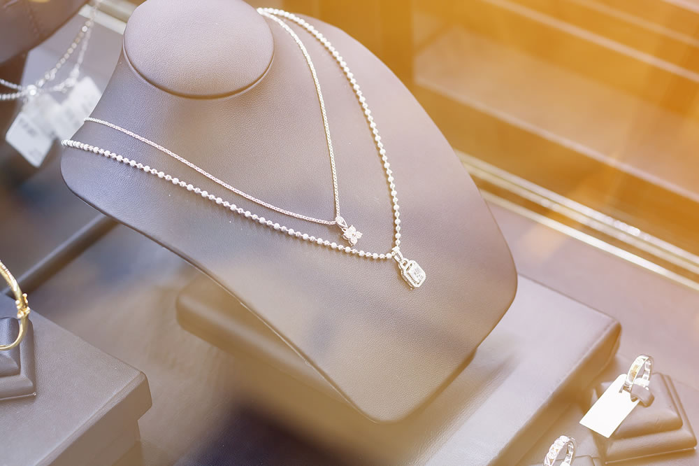 Jewelry diamond necklace in jewelry shop store window display showcase, jewelry diamond