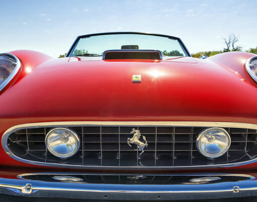 A red 1962 Ferrari 250 GT California Spyder is on display at the 4th Annual Westlake Classic Car Show. Front view.