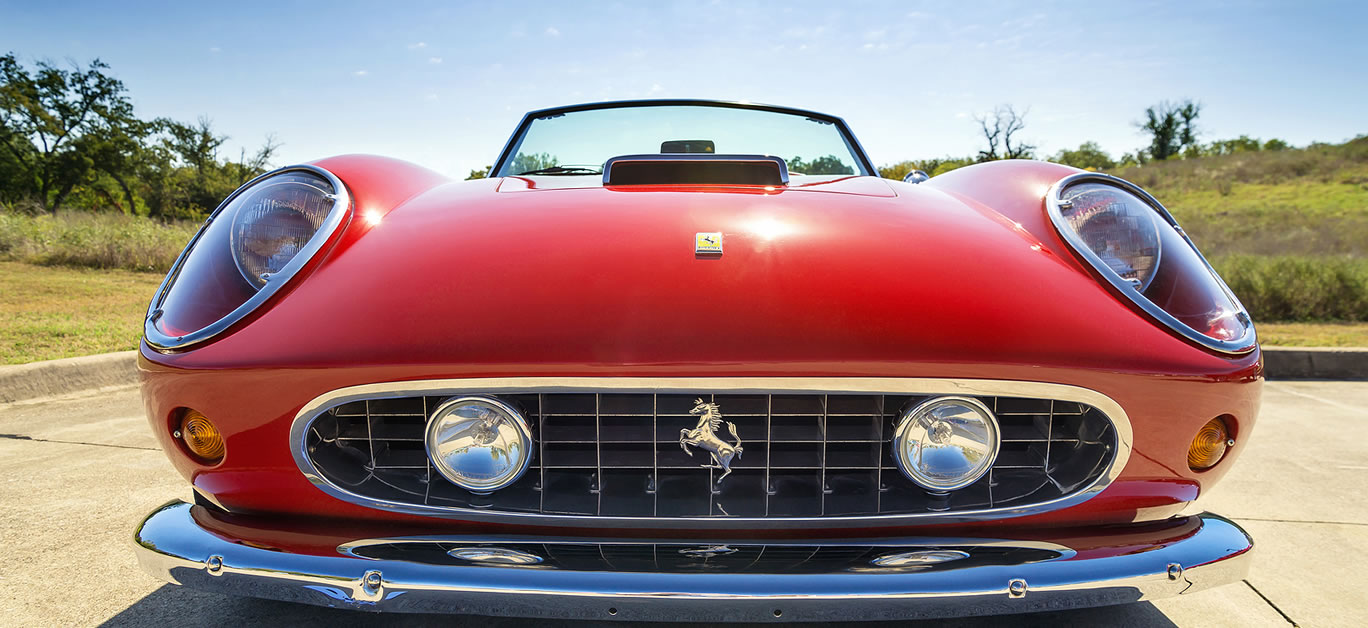 A red 1962 Ferrari 250 GT California Spyder is on display at the 4th Annual Westlake Classic Car Show. Front view.