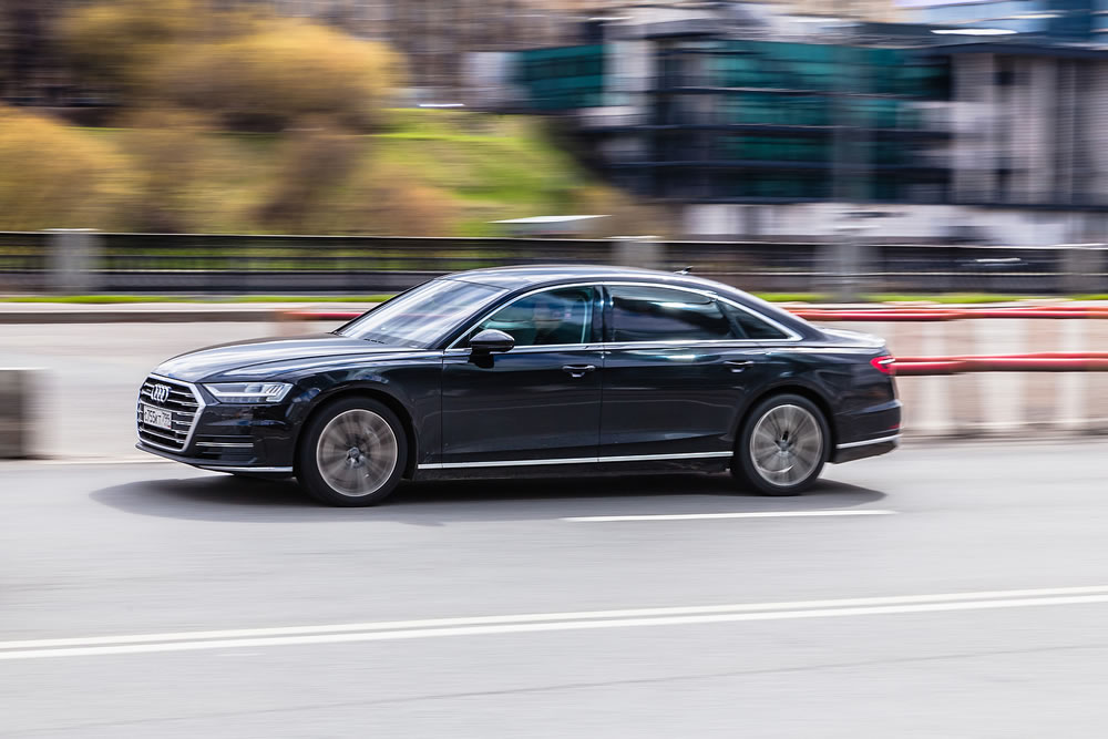 Audi A8 driving along the city street