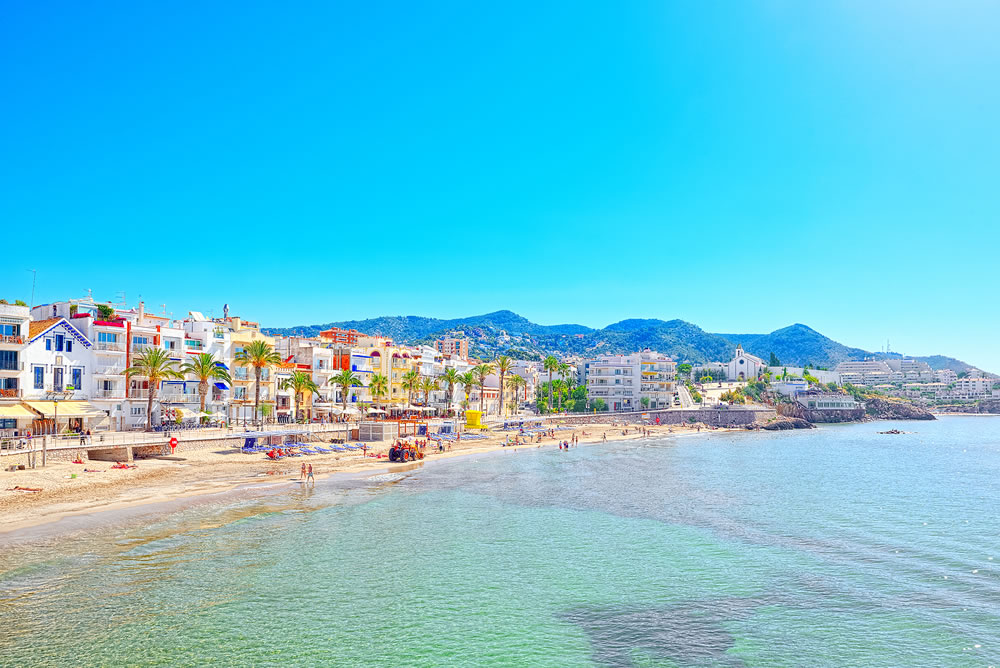 View of the beach and the sea shore of a small resort town Sitges in the suburbs of Barcelona.