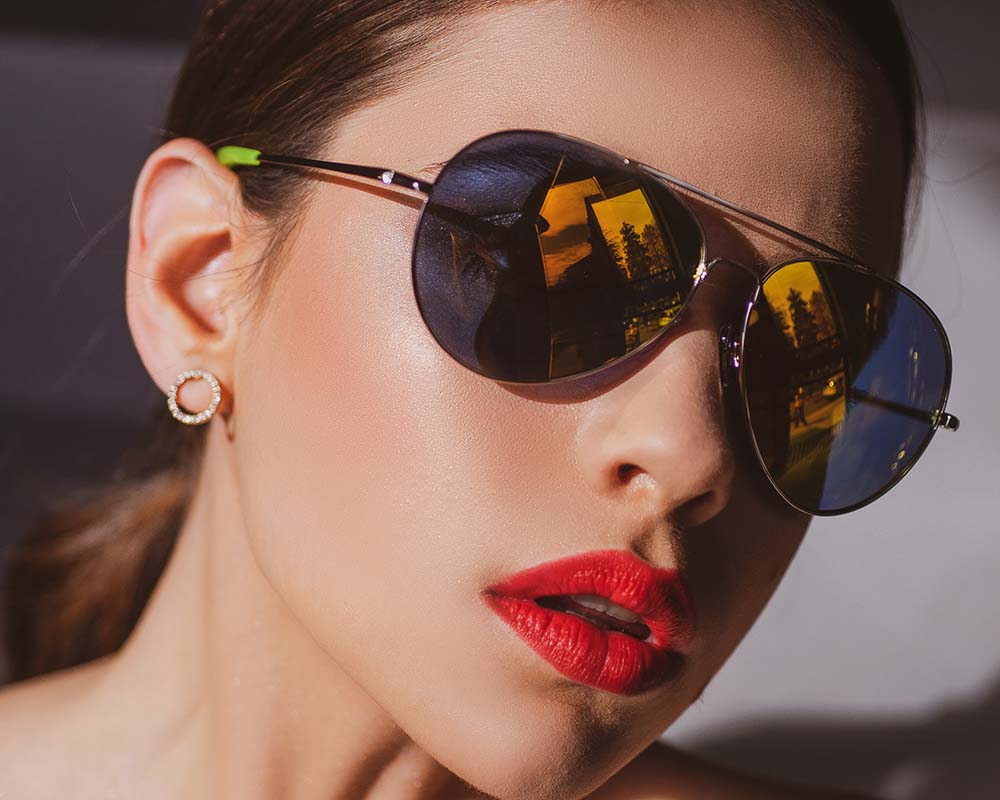 Woman in classic pair of sunglasses