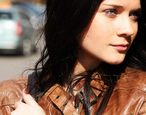 Portrait of the city girl in brown a leather to a jacket
