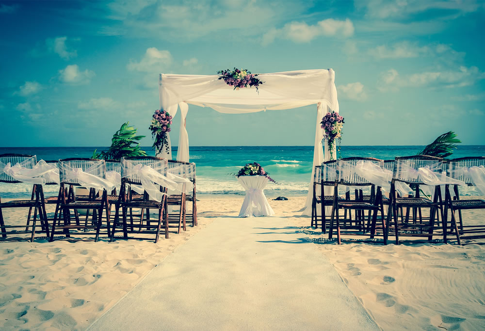 Wedding altar on the beach in Mexico with caribbean sea in the background