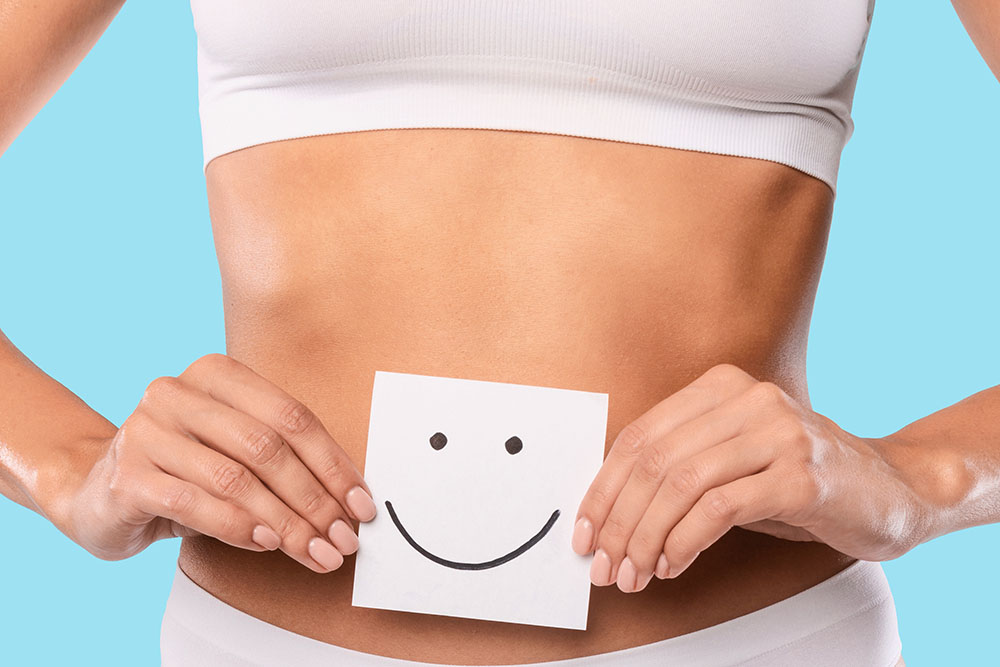 Woman with happy gut sticker