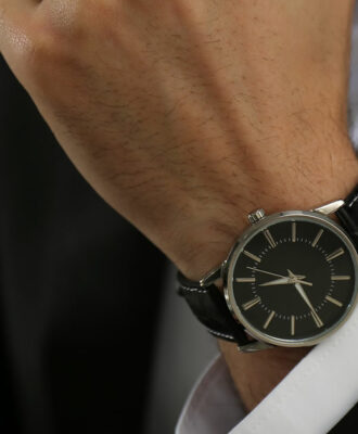 Businessman with luxury wrist watch indoors, closeup
