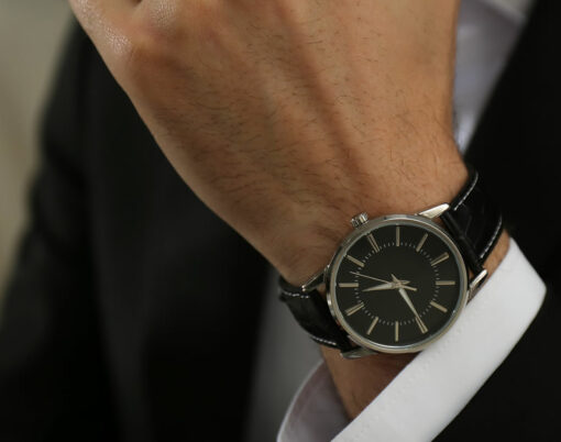 Businessman with luxury wrist watch indoors, closeup