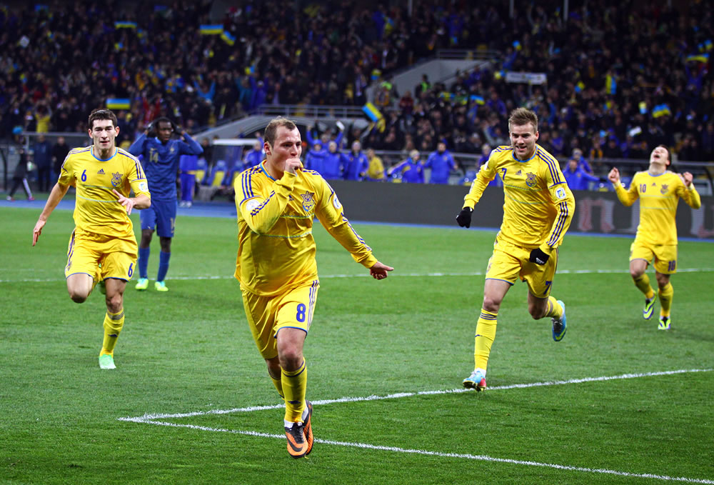 Ukrainian players celebrate after scored a goal against France during their FIFA World Cup 2014 play-off game