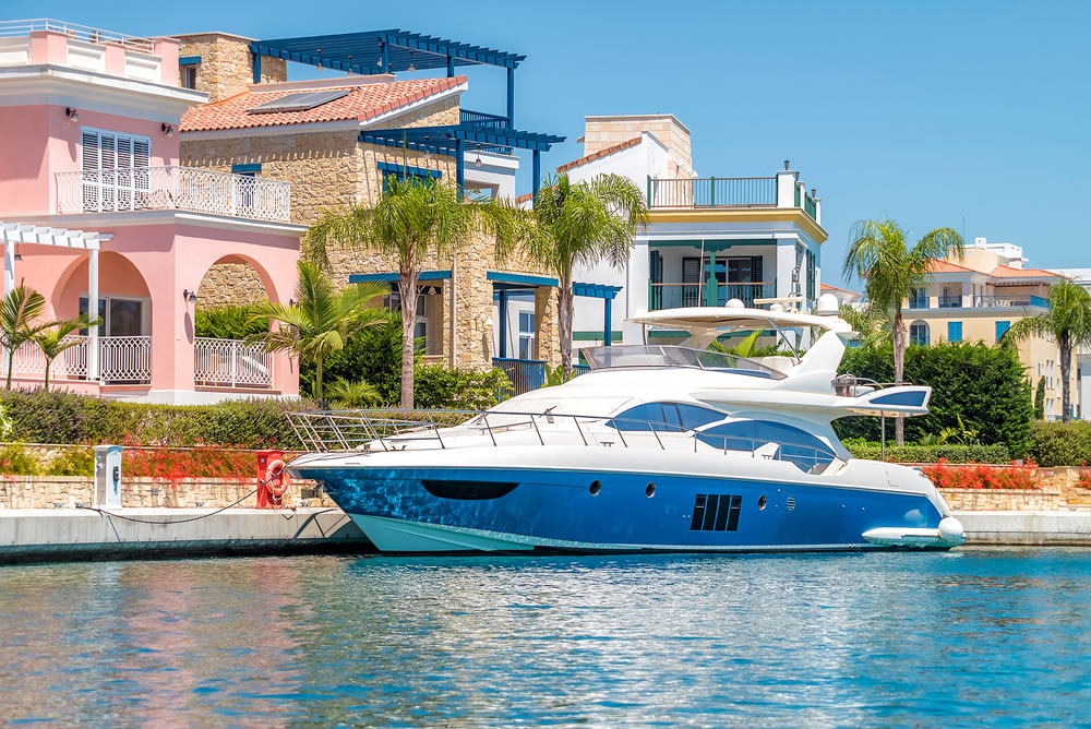 Yacht moored close to luxury residential apartments at Limassol Marina, Cyprus