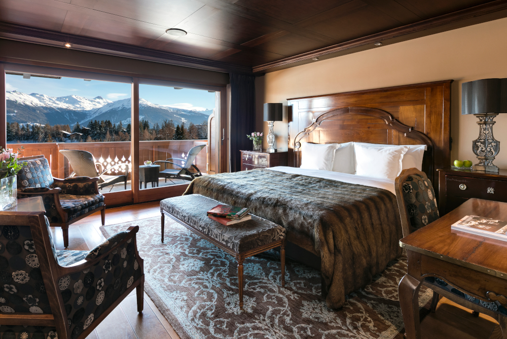 Deluxe rooms at Guarda Golf Hotel & Residences with a view of the Alps