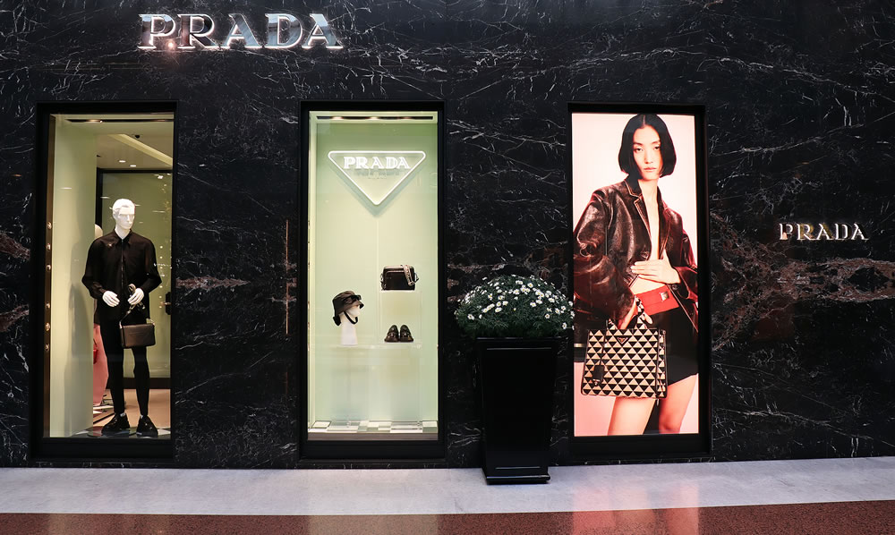 Prada store exterior in Galleria Cavour, famous luxury shopping center in Bologna. Italy