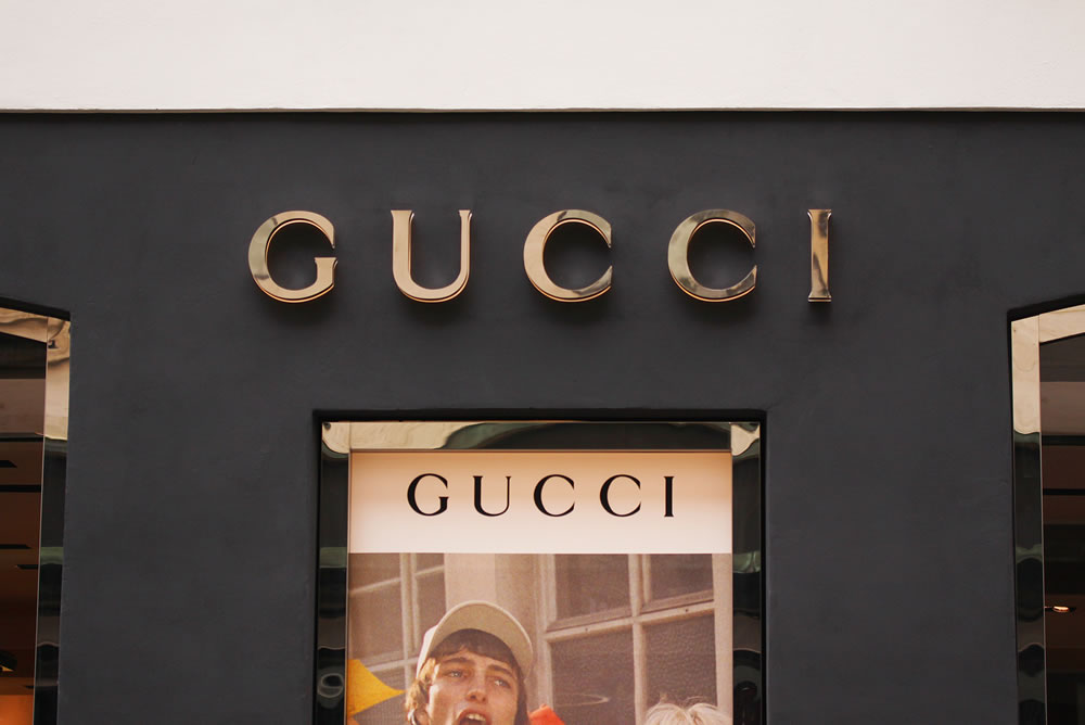 The sign of Gucci at Gucci on store. Gucci is an Italian fashion and leather goods brand.