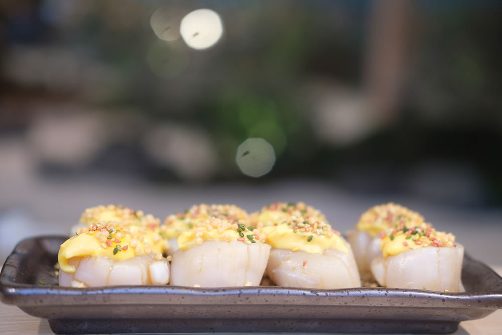 Fresh japanese scallop on top with cheese. Japanese food.