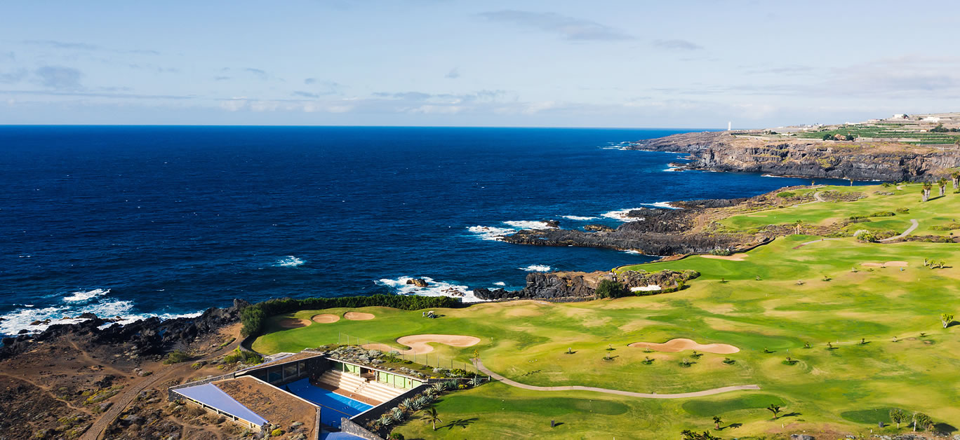 Golf course near the Atlantic ocean in Tenerife, Spain, green Golf course, tennis court in the nature of Tenerife